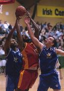 27 January 2002; BJ McFarlan of Burgerking Limerick in action against SX3 Star's Marvin Dixon, left, and John Leahy during the ESB Men's National Cup Final match between SX3 Star and Burgerking Limerick at ESB Arena in Tallaght, Dublin. Photo by Brendan Moran/Sportsfile