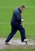 1 February 2002; Shelbourne groundsman, Dave Coombes during a pitch inspection prior to the Eircom League Premier Division match between Shelbourne and Longford Town at Tolka Park in Dublin. Photo by David Maher/Sportsfile