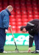 1 February 2002; Shelbourne groundsman, Dave Coombes, left checks the pitch at Tolka park with referee assistant John Ward prior to the Eircom League Premier Division match between Shelbourne and Longford Town at Tolka Park in Dublin. Photo by David Maher/Sportsfile