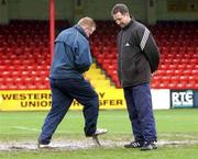 1 February 2002; Shelbourne groundsman, Dave Coombes, left checks the pitch at Tolka park with referee assistant John Ward prior to the Eircom League Premier Division match between Shelbourne and Longford Town at Tolka Park in Dublin. Photo by David Maher/Sportsfile