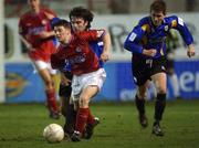 1 February 2002; Wesley Houlihan of Shelbourne in action against Stuart Byrne of Longford Town during the Eircom League Premier Division match between Shelbourne and Longford Town at Tolka Park in Dublin. Photo by David Maher/Sportsfile