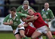 2 February 2002; Jason Holland of Ireland is tackled by Leigh Jarvis and Alix Popham of Wales during the &quot;A&quot; Rugby International match between Ireland A and Wales A at Musgrave Park in Cork. Photo by Brendan Moran/Sportsfile
