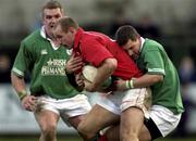 2 February 2002; Gareth Thomas of Wales is tackled by Jason Holland of Ireland during the &quot;A&quot; Rugby International match between Ireland A and Wales A at Musgrave Park in Cork. Photo by Brendan Moran/Sportsfile
