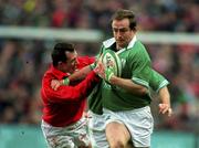3 February 2002; Denis Hickie of Ireland is tackled by Rob Howley of Wales during the Lloyds TSB Six Nations Championship match between Ireland and Wales at Landsdowne Road in Dublin. Photo by Brendan Moran/Sportsfile