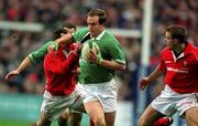 3 February 2002; Denis Hickie of Ireland in action against Rob Howley, left, and Dafydd James of Wales during the Lloyds TSB Six Nations Championship match between Ireland and Wales at Landsdowne Road in Dublin. Photo by Brendan Moran/Sportsfile