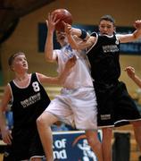 4 February 2002; Martin Higgins of CBS Naas, centre, contests a ball with Brendan Lee, left, and Simon Flynn of Belver during the Bank of Ireland Schools Cup U-16 B Final between Belvedere College, Dublin and CBS Naas, Kildare at ESB Arena in Tallaght, Dublin. Basketball. Photo by Brendan Moran/Sportsfile