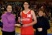 5 February 2002; Castlerea captain Declan Staunton receives the cup from Anne Marie Beirne, left, and Connie Gannon following the Bank of Ireland Schools Cup U16 C Final between Castlerea Community College and Tralee Community College at the ESB Arena in Tallaght, Dublin. Photo by Brendan Moran/Sportsfle