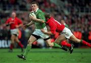 3 February 2002; Brian O'Driscoll of Ireland in action against Kevin Morgan of Wales during the Lloyds TSB Six Nations Championship match between  Ireland and Wales at Landsdowne Road in Dublin. Photo by Matt Browne/Sportsfile