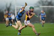 8 January 2017; Harry Kehoe of Wexford is tackled by Huw Lalor of UCD during the Bord na Mona Walsh Cup Group 3 Round 1 match between Wexford and UCD at Páirc Uí Suíochan in Gorey, Co. Wexford. Photo by Ramsey Cardy/Sportsfile