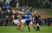 8 January 2017; Johny Murphy of UCD is tackled by David Redmond of Wexford during the Bord na Mona Walsh Cup Group 3 Round 1 match between Wexford and UCD at Páirc Uí Suíochan in Gorey, Co. Wexford. Photo by Ramsey Cardy/Sportsfile