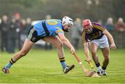 8 January 2017; John O'Toole of UCD in action against Barry Carton of Wexford during the Bord na Mona Walsh Cup Group 3 Round 1 match between Wexford and UCD at Páirc Uí Suíochan in Gorey, Co. Wexford. Photo by Ramsey Cardy/Sportsfile