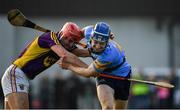 8 January 2017; Eddie Hayden of UCD is tackled by Paul Morris of Wexford during the Bord na Mona Walsh Cup Group 3 Round 1 match between Wexford and UCD at Páirc Uí Suíochan in Gorey, Co. Wexford. Photo by Ramsey Cardy/Sportsfile