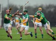 8 January 2017; David King of Offaly in action against James Toher, left, and Niall Weir of Meath during the Bord na Mona Walsh Cup Group 4 Round 1 match between Meath and Offaly at St Loman's Park in Trim, Co. Meath. Photo by Seb Daly/Sportsfile