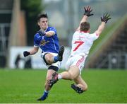 8 January 2017; Gerard Smyth of Cavan scoring a point despite the tackle of Niall Sludden of Tyrone during the Bank of Ireland Dr. McKenna Cup Section C Round 1 match between Cavan and Tyrone at Kingspan Breffni Park in Cavan. Photo by Oliver McVeigh/Sportsfile