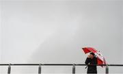 8 January 2017; A spectator shelters from the rain during the McGrath Cup Round 1 match between Kerry and Tipperary at Austin Stack Park in Tralee, Co. Kerry. Photo by Diarmuid Greene/Sportsfile