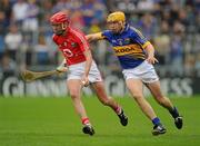 29 May 2011; Lorcan McLoughlin, Cork, in action against David Young, Tipperary. Munster GAA Hurling Senior Championship, Quarter-Final, Tipperary v Cork, Semple Stadium, Thurles, Co. Tipperary. Picture credit: Stephen McCarthy / SPORTSFILE