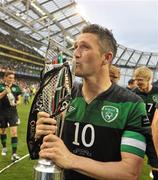 29 May 2011; Robbie Keane, Republic of Ireland, kisses the trophy after the game. Carling Four Nations Tournament, Republic of Ireland v Scotland, Aviva Stadium, Lansdowne Road, Dublin. Picture credit: David Maher / SPORTSFILE