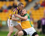 28 May 2011; Colm Morris, Wexford, in action against Sean Pender, Offaly. Leinster GAA Football Senior Championship First Round, Wexford v Offaly, O'Connor Park, Tullamore, Co. Offaly. Picture credit: Pat Murphy / SPORTSFILE
