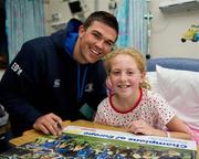 30 May 2011; Leinster's Eoin O'Malley with Aoife Fennell, 11 years, from Donabate, Dublin, during a visit to Temple Street Children's University Hospital by members of the winning Heineken Cup team. The Children's University Hospital, Temple Street, Dublin. Picture credit: Ray McManus / SPORTSFILE