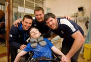 30 May 2011; Leinster's Sean O'Brien, Eoin O'Malley and Shane Horgan with Fabian Lavery, age 13, from Emyvale, Co. Monaghan, during a visit to Temple Street Children's University Hospital by members of the winning Heineken Cup team. The Children's University Hospital, Temple Street, Dublin. Picture credit: Ray McManus / SPORTSFILE