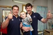 30 May 2011; Leinster's Sean O'Brien and Shane Horgan with Conor Daly, age 6, from Drumreilly, Co. Leitrim, during a visit to Temple Street Children's University Hospital by members of the winning Heineken Cup team. The Children's University Hospital, Temple Street, Dublin. Picture credit: Ray McManus / SPORTSFILE