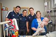 30 May 2011; Leinster's Shane Horgan, Eoin O'Malley and  Sean O'Brien with one year old Ben Gillick and his mother Miriam, from Chapelizod, Dublin, during a visit to Temple Street Children's University Hospital by members of the winning Heineken Cup team. The Children's University Hospital, Temple Street, Dublin. Picture credit: Ray McManus / SPORTSFILE