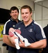30 May 2011; Leinster's Shane Horgan and Sean O'Brien with five week old Adam Marmion, from Ardee, Co. Louth, during a visit to Temple Street Children's University Hospital by members of the winning Heineken Cup team. The Children's University Hospital, Temple Street, Dublin. Picture credit: Ray McManus / SPORTSFILE