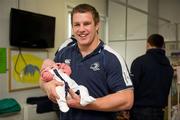 30 May 2011; Leinster's Sean O'Brien with five week old Adam Marmion, from Ardee, Co. Louth, during a visit to Temple Street Children's University Hospital by members of the winning Heineken Cup team. The Children's University Hospital, Temple Street, Dublin. Picture credit: Ray McManus / SPORTSFILE