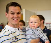 30 May 2011; Leinster's Johnny Sexton with six month old Samuel Redmond, from East Wall, Dublin, during a visit to Temple Street Children's University Hospital by members of the winning Heineken Cup team. The Children's University Hospital, Temple Street, Dublin. Picture credit: Ray McManus / SPORTSFILE