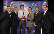 30 May 2011; Pictured is Thomas Flynn from Galway receiving the 2011 Cadbury Hero of the Future Award with, from left, Paul Caffrey, Páraic Ó Dufaigh, Ard-Stiúrthóir, GAA, Shane Guest, Cadbury Ireland, darragh O'Se and Dermot Earley. Thomas was one of 14 shortlisted players who had excelled throughout the 2011 Cadbury GAA U21 Football Championship, all nominees can be seen on www.cadburygaau21.com Past winners include Rory O’Carroll from Dublin, Colm O’Neill and Fintan Goold from Cork, Killian Young from Kerry and Keith Higgins from Mayo and all have gone on to represent their counties at senior level. Thomas, who plays his club football with St Mary’s Athenry was named as a Cadbury Hero of the Match for his performance against Cork in the All Ireland Semi Final. The judging panel which consisted of senior Kildare footballer Dermot Earley, former Dublin manager Paul Caffrey, TG4 journalist Michael O’Domhnaill and former Kerry and All Star player Darragh O’Se gave serious consideration to the public votes cast on cadburygaau21.com, but ultimately Thomas Flynn’s heroic performances in both the semi-final against Cork and the final against Cavan edged the competition out in the end. 2011 Cadbury Hero of the Future Awards, Croke Park, Dublin. Picture credit: Pat Murphy / SPORTSFILE