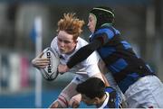 10 January 2017; Adam Kiernan of Presentation College Bray is tackled by Kevin Farrington, right, and Oisin K. Smith of Mount Temple during the Bank of Ireland Fr Godfrey Cup Round 1 match between Presentation College Bray and Mount Temple at Donnybrook Stadium in Donnybrook, Dublin. Photo by Cody Glenn/Sportsfile