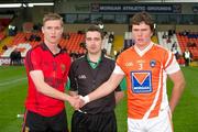 28 May 2011; The Down captain, Caolan Mooney, and the Armagh captain, Conor White, shake hands accross referee Noel Mooney. Ulster GAA Football Minor Championship Quarter-Final, Armagh v Down, Morgan Athletic Grounds, Armagh. Picture credit: Ray McManus / SPORTSFILE