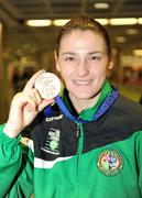 4 June 2011; Ireland's Katie Taylor in Dublin Airport on her return from the European Union Women's Boxing Championships Finals where she won Gold in the 60Kg Final. Dublin Airport, Dublin. Picture credit: Ray McManus / SPORTSFILE