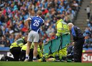 5 June 2011; Daithi Carroll, Laois, receives treatment from the team physio and paramedics after a collision with Rory Carroll, Dublin, as team-mate Donal Kingston looks on. Leinster GAA Football Senior Championship Quarter-Final, Laois v Dublin, Croke Park, Dublin. Picture credit: Barry Cregg / SPORTSFILE