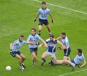 5 June 2011; John O'Loughlin, Laois, is put under pressure by Dublin defenders, from left, James McCarthy, Michael Fitzsimons, Rory O'Carroll, Philly McMahon and Ger Brennan. Leinster GAA Football Senior Championship Quarter-Final, Laois v Dublin, Croke Park, Dublin. Picture credit: Brendan Moran / SPORTSFILE