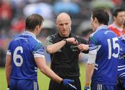 5 June 2011; Dessie Mone and Conor McManus, Monaghan, reminstraites with Referee Cormac Reilly after Dessie Mone was sent off near the end of the game. Ulster GAA Football Senior Championship Quarter-Final, Healy Park, Tyrone v Monaghan, Omagh, Co. Tyrone. Picture credit: Oliver McVeigh / SPORTSFILE