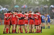 5 June 2011; The Tyrone team in a pre-match huddle. Ulster GAA Football Senior Championship Quarter-Final, Healy Park, Tyrone v Monaghan, Omagh, Co. Tyrone. Picture credit: Oliver McVeigh / SPORTSFILE