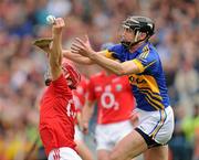 29 May 2011; Paudie O'Sullivan, Cork, in action against Paul Curran, Tipperary. Munster GAA Hurling Senior Championship, Quarter-Final, Tipperary v Cork, Semple Stadium, Thurles, Co. Tipperary. Picture credit: Ray McManus / SPORTSFILE
