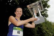 6 June 2011; Donegal's Catriona Jennings lifts the trophy after winning the 2011 Flora Womens Mini Marathon. 2011 Flora Womens Mini Marathon, Dublin City. Picture credit: Pat Murphy / SPORTSFILE