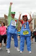 6 June 2011; John Brady and Kathy Matthews, both from Coolock, Dublin, dressed as the 'Super Mario Brothers', before the 2011 Flora Womens Mini Marathon. 2011 Flora Womens Mini Marathon, Dublin City. Picture credit: Pat Murphy / SPORTSFILE