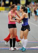 6 June 2011; Donegal's Catriona Jennings is congratulated by second placed Siobhan O'Doherty, Nenagh, Co. Tipperary, left, after winning the 2011 Flora Womens Mini Marathon. 2011 Flora Womens Mini Marathon, Dublin City. Picture credit: Pat Murphy / SPORTSFILE