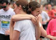 6 June 2011; Competitors celebrate after finishing the 2011 Flora Womens Mini Marathon. 2011 Flora Womens Mini Marathon, Dublin City. Picture credit: Pat Murphy / SPORTSFILE