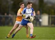 15 January 2017; Michael Bannigan of Monaghan in action against Conor Hamill of Antrim during the Bank of Ireland Dr. McKenna Cup Section B Round 2 match between Antrim and Monaghan at Glenavy in Co. Antrim. Photo by Mark Marlow/Sportsfile