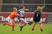 5 June 2011; Laura McEnaney, Monaghan, in action against Sinead McCoy and Catherine McAlinden, Armagh. Ulster Ladies Football Senior Championship, Armagh v Monaghan, Armagh v Monaghan, Healy Park, Omagh, Co. Tyrone. Picture credit: Oliver McVeigh / SPORTSFILE
