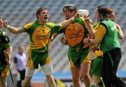 4 June 2011; Donegal Ciaran Mathewson, left, celebrates with Jamesie Donnelly, centre, and Andrew Wallace, manager, right, celebrate after the game. Lory Meagher Cup Final, Tyrone v Donegal, Croke Park, Dublin. Picture credit: Pat Murphy / SPORTSFILE