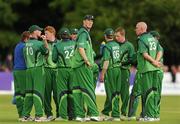 30 May 2011; Boyd Rankin, Ireland, centre, looks onat the team are in a huddle. RSA ODI Series, Ireland v Pakistan, 2nd Test, Stormont, Belfast, Co. Antrim. Picture credit: Oliver McVeigh / SPORTSFILE