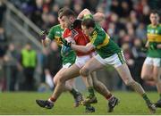 15 January 2017; Peter Kelleher of Cork in action against Mark Griffin, right, and Tom O'Sullivan, left, of Kerry during the McGrath Cup Round 3 match between Cork and Kerry at Mallow GAA Grounds in Mallow, Co Cork. Photo by Eóin Noonan/Sportsfile