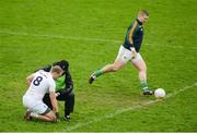 15 January 2017; Tommy Moolick of Kildare is treated for an injury as Offaly goalkeeper Alan Mulhall takes a kickout during the Bord na Mona O'Byrne Cup Group 2 Round 3 match between Offaly and Kildare at O'Connor Park in Tullamore, Co Offaly. Photo by Piaras Ó Mídheach/Sportsfile