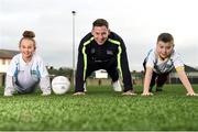16 January 2017; Dublin footballer Philly McMahon, pictured doing push-ups with Nicole Cleary, age 11, from St. Brigid's GNS, and Sean McHugh, age 11, from Scoil Chiarain CBS, at the GAA Healthy Clubs launch at Craobh Chiarain GAA Club, Parnell Park in Donnycarney, Dublin. The GAA launched the next stage of their pioneering project to transform Ireland's GAA clubs into ground-breaking healthy hubs. The launch intends to encourage more GAA clubs to get involved to support communities in pursuit of better physical, social and mental wellbeing. Photo by Cody Glenn/Sportsfile