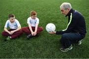 16 January 2017; Tyrone manager Mickey Harte teaches a hand pass to Sean McHugh, left, and Jamie Smyth, both age 11 and from Scoil Chiarain CBS, at the GAA Healthy Clubs launch at Craobh Chiarain GAA Club, Parnell Park in Donnycarney, Dublin. The GAA launched the next stage of their pioneering project to transform Ireland's GAA clubs into ground-breaking healthy hubs. The launch intends to encourage more GAA clubs to get involved to support communities in pursuit of better physical, social and mental wellbeing. Photo by Cody Glenn/Sportsfile
